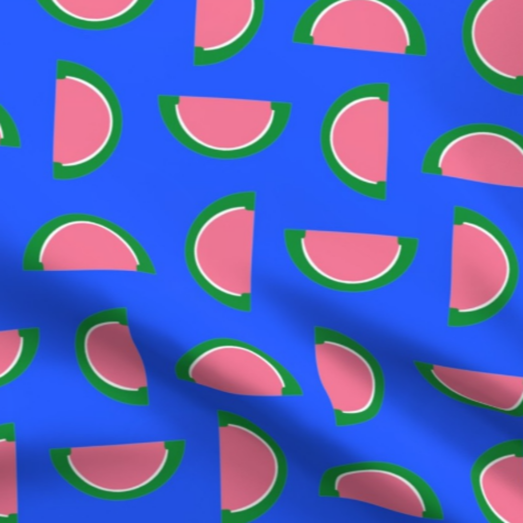 Watermelon Pink and Green Jelly Candy Fruit Slices on Sky Blue Fabric